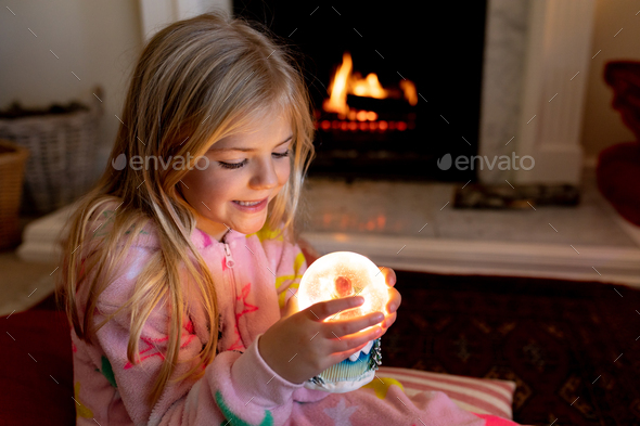 Girl at home at Christmas time - Stock Photo - Images