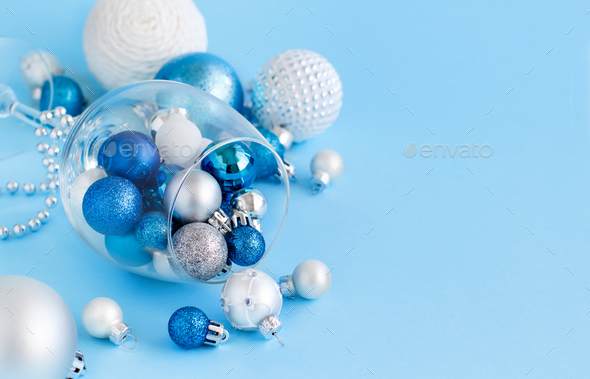 Christmas Baubles In A Wine Glass On A Light Blue Background Stock