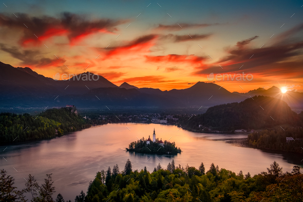 Colorful landscape sunrise at Lake Bled dramatic sky, Slovenia - Stock Photo - Images