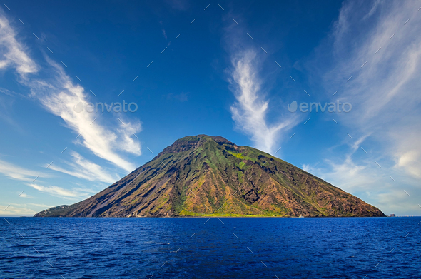 Volcanic island Stromboli in Lipari viewed from the ocean with nice clouds, Sicily - Stock Photo - Images