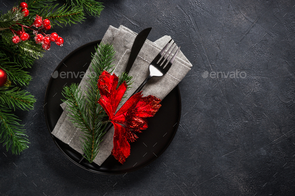 Christmas table setting on black top view - Stock Photo - Images