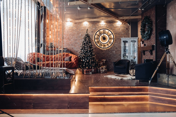 Modern studio with Christmas tree. Loft design interior - Stock Photo - Images