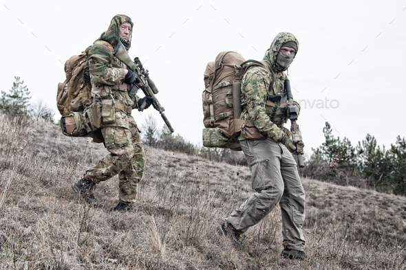 Military army soldiers team members patrolling area - Stock Photo - Images