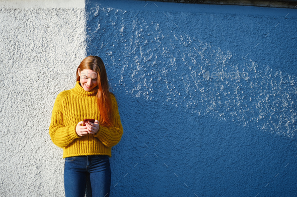 Young Redhead Woman Sending Text Message With Phone - Stock Photo - Images