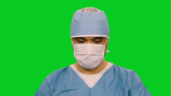 Concentrated Surgeon In Mask Working During Operation