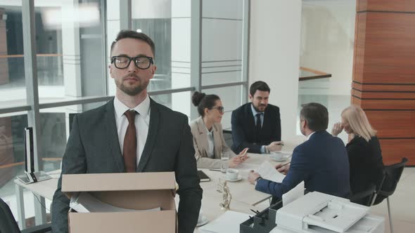 Portrait of Lawyer with Box of Legal Documents alt
