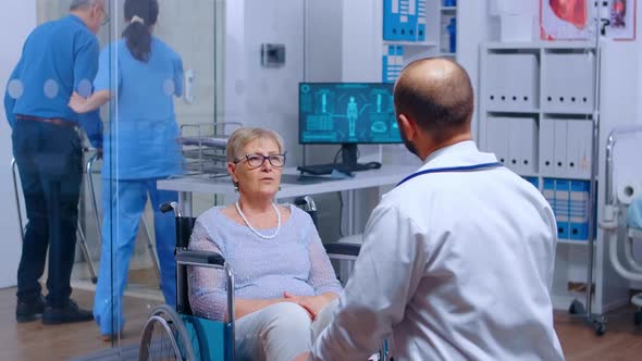 Elderly Woman in Wheelchair at Doctor Appointment alt