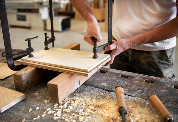 Carpenter or woodworker using a vice - Stock Photo - Images