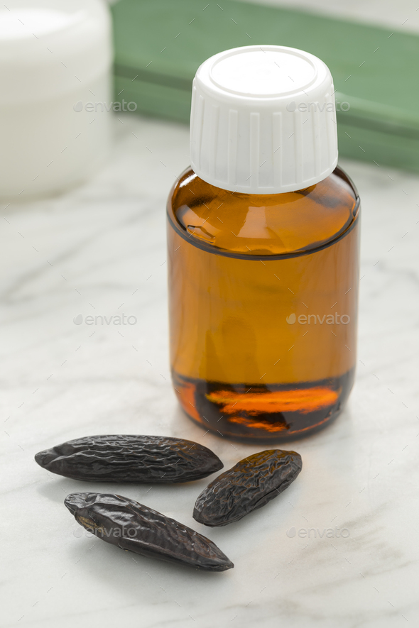 Essential oil made from Tonka beans Stock Photo by picturepartners