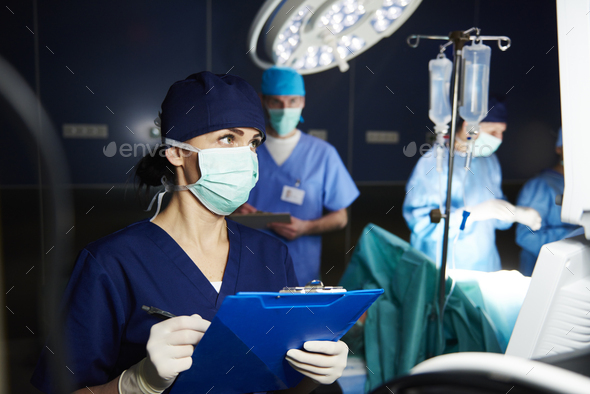 Nurse examining all the parameters - Stock Photo - Images