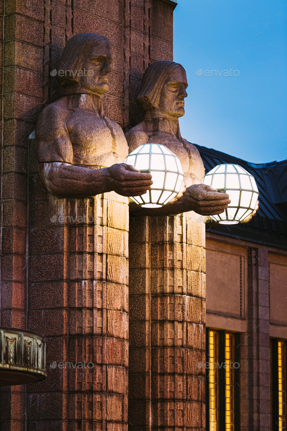 Helsinki, Finland. Night View Of Two Pairs Of Statues Holding The Spherical Lamps On Entrance To - Stock Photo - Images