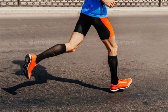 legs male runner in compression socks
