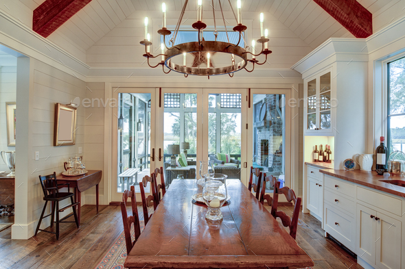 Beautiful diningroom with view onto porch and waterfront property.