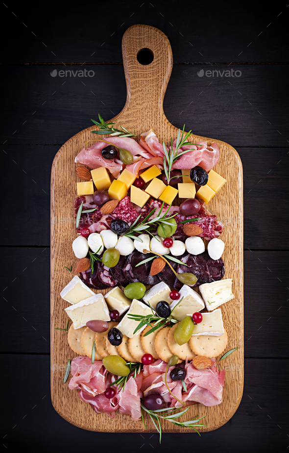 Antipasto platter with ham, prosciutto, salami, cheese, crackers and olives - Stock Photo - Images