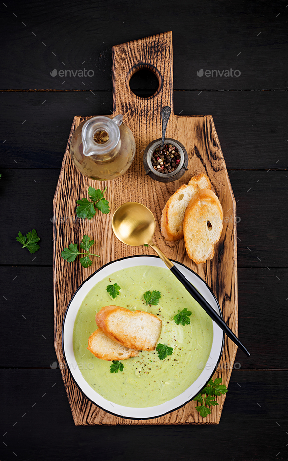 Homemade broccoli cream soup with croutons in white bowl - Stock Photo - Images