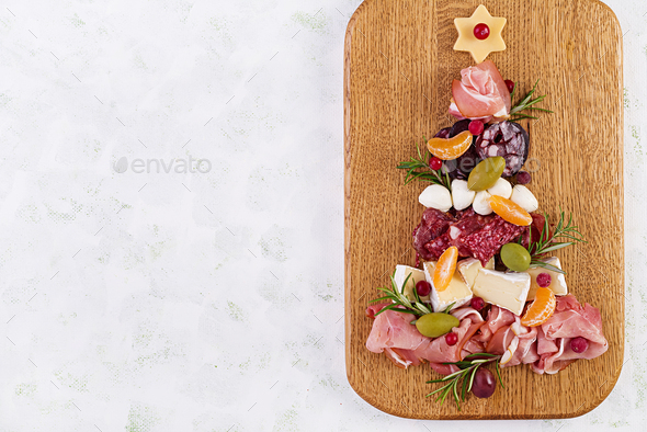 Antipasto platter with ham, prosciutto, salami, cheese, crackers and olives - Stock Photo - Images