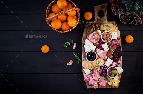 Antipasto platter with ham, prosciutto, salami, cheese, crackers and olives - Stock Photo - Images
