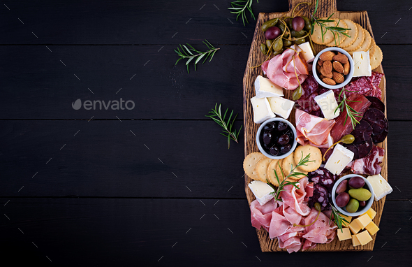 Antipasto platter with ham, prosciutto, salami, cheese, crackers and olives - Stock Photo - Images