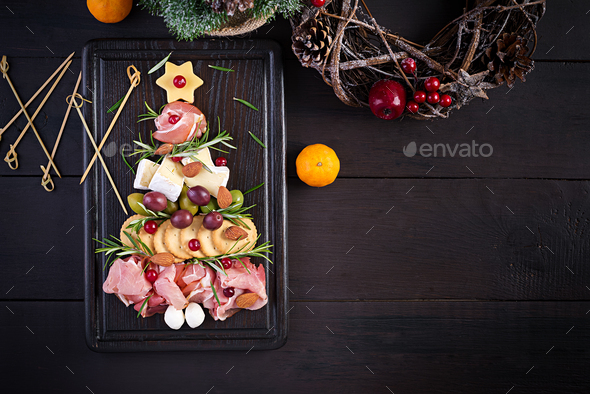 Antipasto platter with ham, prosciutto, salami, cheese, crackers and olives - Stock Photo - Images