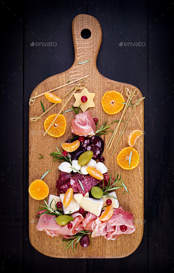 Antipasto platter with ham, prosciutto, salami, cheese, crackers and olives - Stock Photo - Images
