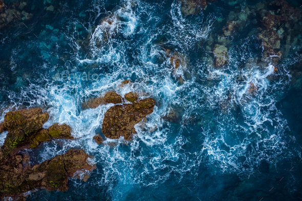 Rocky shore of the island of Tenerife. Aerial drone photo of ocean waves reaching shore - Stock Photo - Images
