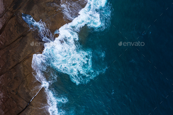 Rocky shore of the island of Tenerife. Aerial drone photo of ocean waves reaching shore - Stock Photo - Images