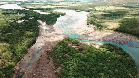 Cinematic drone footage - flying sideways over the river showing a mountains at minas gerais in Braz alt