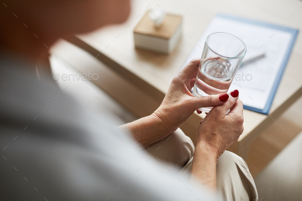 Therapy Patient Holding Glass of Water - Stock Photo - Images