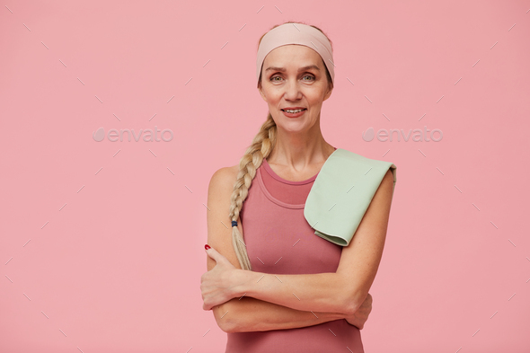 Sportive Adult Woman Posing against Pink - Stock Photo - Images