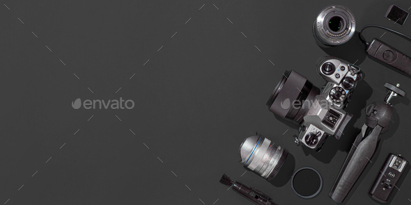 Camera and accessories on black, copy space - Stock Photo - Images