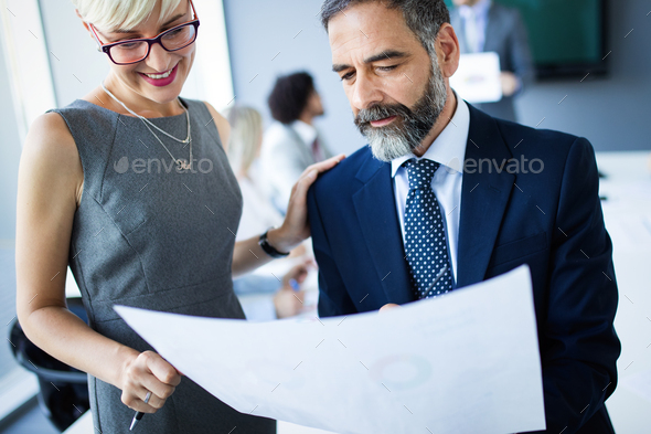 Successful team leader and business owner leading informal in-house business meeting - Stock Photo - Images