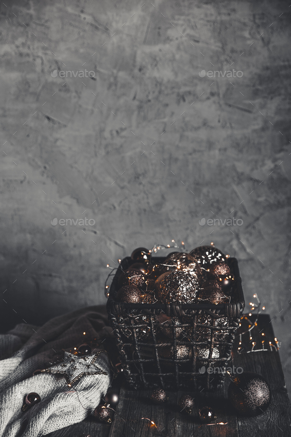 vintage christmas, new Year toys and decoration in basket on brown wooden table with garlands - Stock Photo - Images