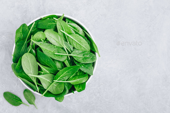Fresh Spinach Leaves. Raw Spinach in a bowl for vegetarian or vegan salad or smoothie. - Stock Photo - Images