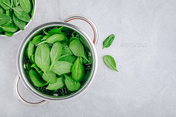 Fresh Spinach Leaves. Raw Spinach in a colander for vegetarian or vegan salad or smoothie. - Stock Photo - Images