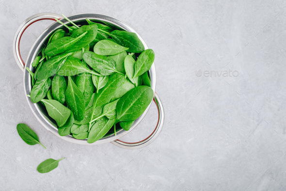 Fresh Spinach Leaves. Raw Spinach in a colander for vegetarian or vegan salad or smoothie. - Stock Photo - Images