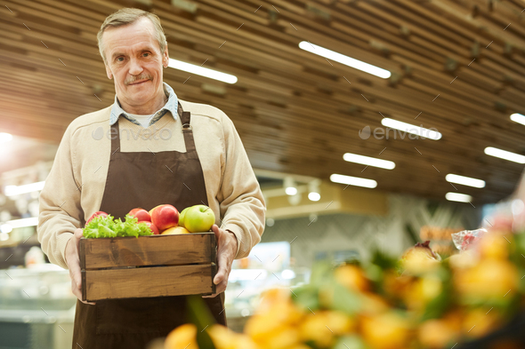 Senior Man Holding Box of Delicious Apples - Stock Photo - Images