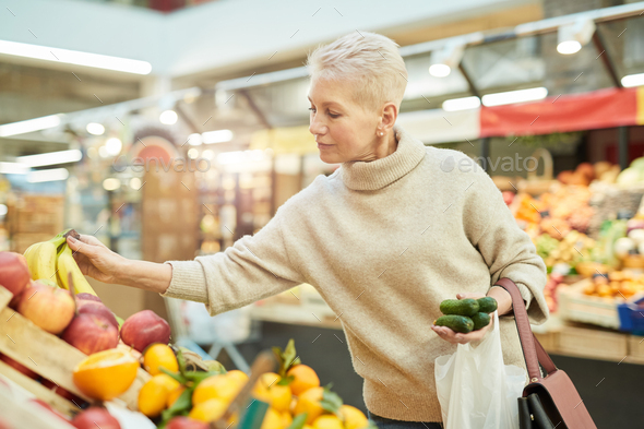 Mature Woman Grocery Shopping at Farmers Market - Stock Photo - Images