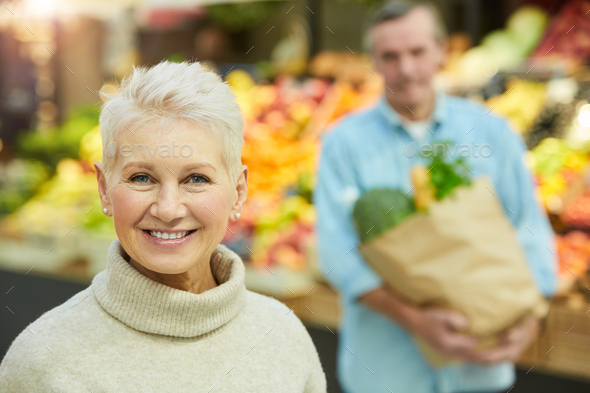 Smiling Senior Woman in Supermarket - Stock Photo - Images