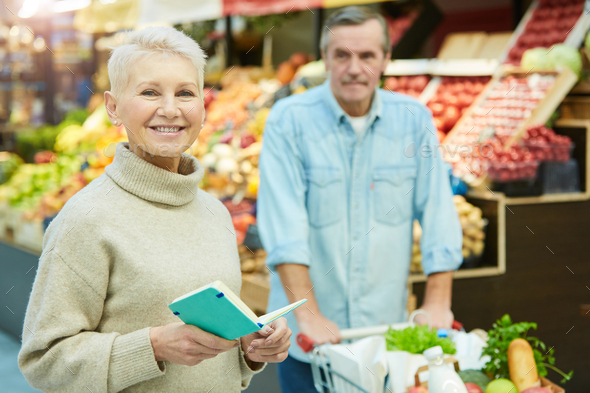 Smiling Senior Woman Buying Groceries in Supermarket - Stock Photo - Images