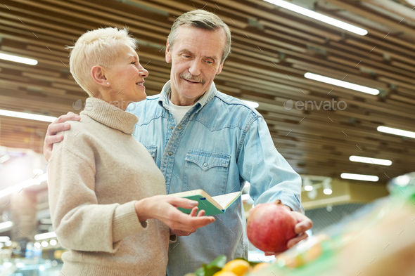 Smiling Senior Couple Grocery Shopping at Farmers Market - Stock Photo - Images