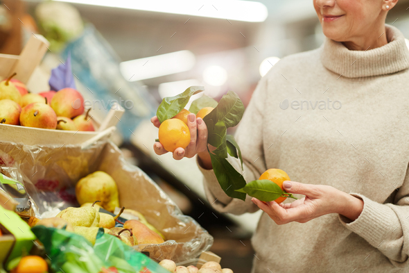 Woman Choosing Fruits at Farmers Market