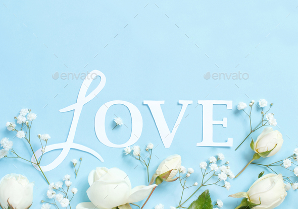 Flowers And Word Love On A Light Blue Background Stock Photo By