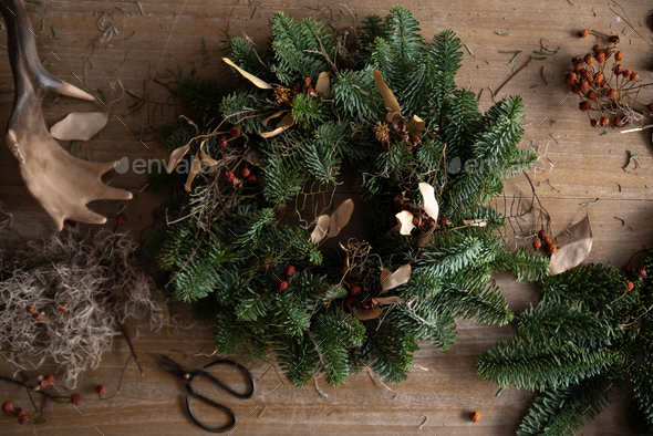 Woman making Christmas wreath of spruce, step by step. - Stock Photo - Images