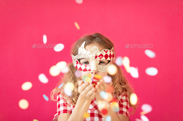 Fancy girl blowing confetti against pink bakground - Stock Photo - Images