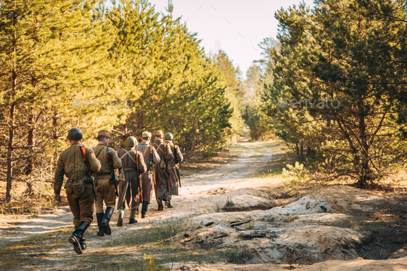 Group Of Re-enactors Dressed As Soviet Russian Red Army Infantry Soldiers Of World War II Marching - Stock Photo - Images
