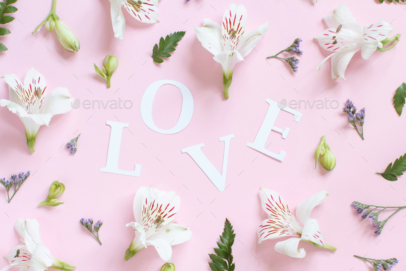 Flowers Nad Word Love On A Light Pink Background Stock Photo By