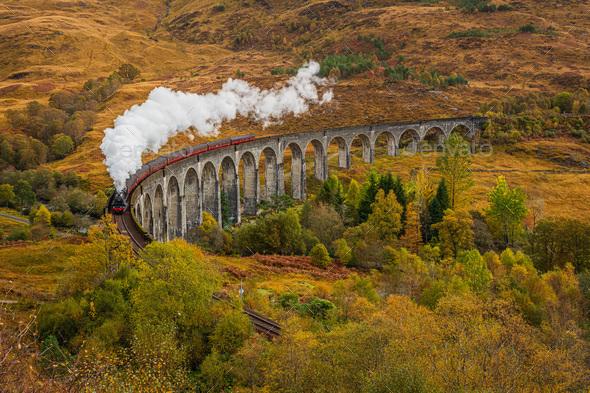 Old Fashioned Steam Train with Air Whistle on Glenfinnan Viaduct, Scotland in Autumn - Stock Photo - Images