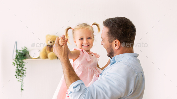 Portrait of daughter dancing with her dad - Stock Photo - Images