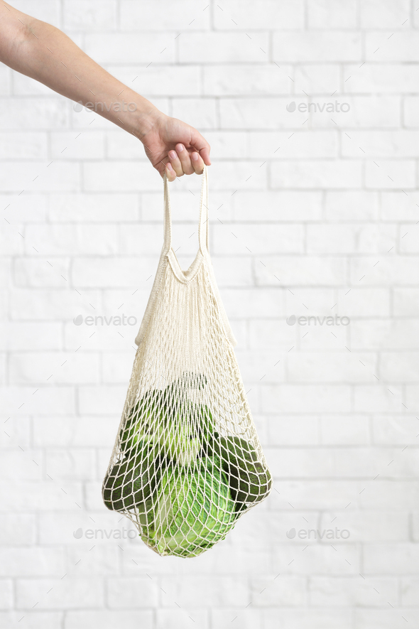 Woman holding in hand Green vegetables for healthy nutrition - Stock Photo - Images