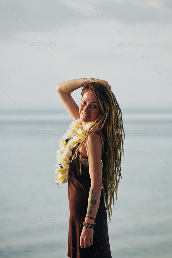 Pretty woman with flower necklace - Stock Photo - Images